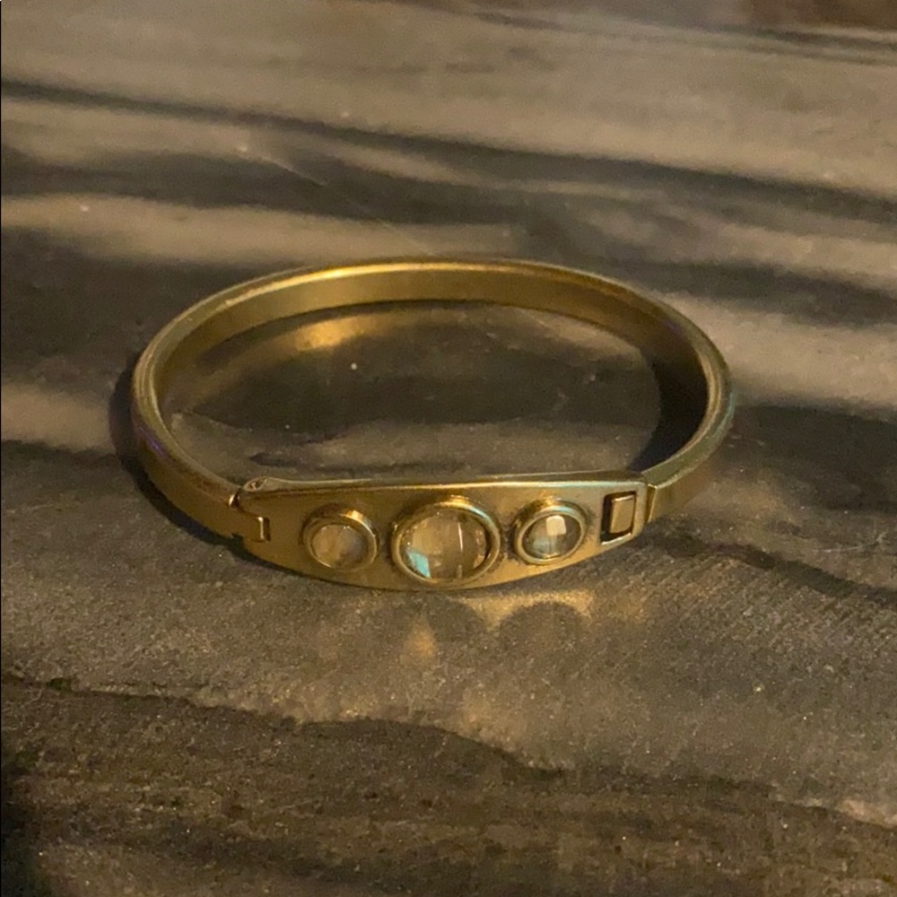 Lucky Brand gold bangle with latch enclose